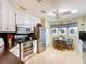 Eat-in kitchen with stainless steel appliances and wood table and chairs at 6044 Grand Oaks Se Dr, Winter Haven, FL 33884