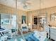 Relaxing sunroom with hanging swing chairs and comfortable seating at 6044 Grand Oaks Se Dr, Winter Haven, FL 33884