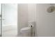 Bright bathroom featuring a soaking tub and a toilet with a modern shower stall at 647 Washington Way, Haines City, FL 33844