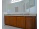 Bathroom vanity featuring granite countertops and ample storage space below at 647 Washington Way, Haines City, FL 33844