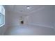 View of a bedroom showing a doorway to an en-suite bathroom, tile floors, and neutral walls at 647 Washington Way, Haines City, FL 33844