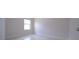 Bright bedroom with a window at 647 Washington Way, Haines City, FL 33844