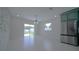 Eat-in kitchen with modern lighting and a sliding glass door leading to the backyard at 647 Washington Way, Haines City, FL 33844