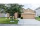 Charming exterior elevation of a home with a well-maintained yard and a cozy front porch at 647 Washington Way, Haines City, FL 33844
