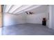 Spacious garage with storage shelves, perfect for parking and organizing tools and equipment at 647 Washington Way, Haines City, FL 33844