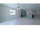 Spacious kitchen and dining area featuring custom cabinets, stainless steel appliances, and plenty of natural light at 647 Washington Way, Haines City, FL 33844