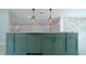 Spacious kitchen island with elegant countertops, modern faucet, and ample storage space, perfect for entertaining at 647 Washington Way, Haines City, FL 33844