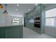 Modern kitchen showcasing stainless steel appliances, ample counter space, and sleek cabinetry at 647 Washington Way, Haines City, FL 33844