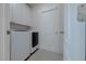 Laundry room with washer, dryer, and storage cabinets at 647 Washington Way, Haines City, FL 33844