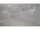 The large living room features tile floors and recessed lighting, offering a bright and airy ambiance at 647 Washington Way, Haines City, FL 33844