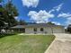 Charming single-story home boasts an attached two-car garage and a well-maintained lawn at 7200 Green Pine Ct, Orlando, FL 32819