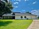 Charming single-story home boasts a lush lawn and attached two-car garage at 7200 Green Pine Ct, Orlando, FL 32819