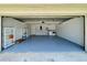 Well-organized garage with epoxy floors, storage shelves, and a utility area at 7200 Green Pine Ct, Orlando, FL 32819