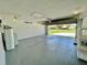 Spacious two-car garage with epoxy flooring, water heater, and storage shelves at 7200 Green Pine Ct, Orlando, FL 32819