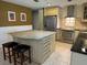 Kitchen island with granite countertops, stainless steel appliances, and wooden cabinets at 7200 Green Pine Ct, Orlando, FL 32819