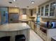 Modern kitchen with stainless steel appliances, granite countertops and lots of natural light at 7200 Green Pine Ct, Orlando, FL 32819