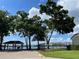 Community lake view and picnic area with a shaded pavilion and seating, perfect for relaxing outdoors at 7200 Green Pine Ct, Orlando, FL 32819