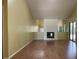 Inviting living room with hardwood floors, a fireplace, and a mirrored wall that adds depth to the space at 7200 Green Pine Ct, Orlando, FL 32819