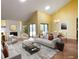 Bright living room and dining room featuring hardwood floors and a fireplace, with a view to the backyard at 7200 Green Pine Ct, Orlando, FL 32819