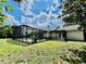 Enjoy your screened in pool surrounded by a spacious yard, ideal for outdoor relaxation and entertaining at 7200 Green Pine Ct, Orlando, FL 32819