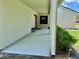The well-lit front porch includes a bench and offers shelter with an overhang and painted concrete at 7200 Green Pine Ct, Orlando, FL 32819