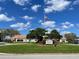 A community recreation center with an American flag, landscaping, and a welcoming entrance for residents at 7200 Green Pine Ct, Orlando, FL 32819