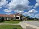 A well-maintained recreation center with a tiled roof, walkway, and landscaped grounds for community enjoyment at 7200 Green Pine Ct, Orlando, FL 32819