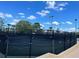 Community tennis courts with fencing and lighting, offering a convenient recreational amenity for residents at 7200 Green Pine Ct, Orlando, FL 32819