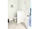 Clean half-bathroom with decorative elements, tiled floors, and neutral color scheme at 726 Longboat, Davenport, FL 33896