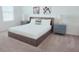 Serene bedroom features a queen bed, carpet, and two matching nightstands with lamps at 726 Longboat, Davenport, FL 33896