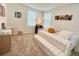 Bedroom featuring neutral carpet, two windows, a trundle bed and cartoon artwork at 726 Longboat, Davenport, FL 33896