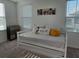 Charming bedroom with daybed, striped bedding, and sunny window at 726 Longboat, Davenport, FL 33896
