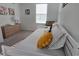 Bright bedroom with white walls, a cozy bed, and natural light from the window at 726 Longboat, Davenport, FL 33896