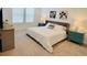 Bright bedroom with a plush bed, natural light, and teal nightstands at 726 Longboat, Davenport, FL 33896