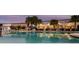 A large, inviting community pool surrounded by lounge chairs and lush landscaping, perfect for relaxation at 726 Longboat, Davenport, FL 33896