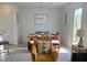 Inviting dining room with modern decor, ample natural light, and seating for six at 726 Longboat, Davenport, FL 33896