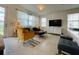Bright living room features modern décor, sheer curtains, and TV at 726 Longboat, Davenport, FL 33896