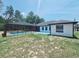A well-maintained backyard features a screened-in pool, offering a perfect outdoor retreat at 726 Marion Oaks Ln, Ocala, FL 34473