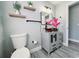 Bathroom featuring floating shelves, bowl sink, modern finishes, and stylish decor, offering a fresh and appealing space at 726 Marion Oaks Ln, Ocala, FL 34473