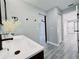 Bathroom featuring a double sink vanity and an open view to the main bedroom at 726 Marion Oaks Ln, Ocala, FL 34473