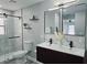 Bright bathroom showcasing a glass-enclosed shower, double sink vanity and modern design at 726 Marion Oaks Ln, Ocala, FL 34473