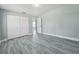 Bedroom featuring wood-look flooring and a closet, creating a practical and adaptable living space at 726 Marion Oaks Ln, Ocala, FL 34473