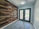 The entryway features a decorative accent wall and a gray laminate flooring at 726 Marion Oaks Ln, Ocala, FL 34473