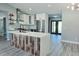 Contemporary kitchen featuring an island with wooden accents, stainless steel appliances, and marble backsplash at 726 Marion Oaks Ln, Ocala, FL 34473