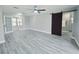 Spacious main bedroom with light gray flooring and ensuite bathroom access at 726 Marion Oaks Ln, Ocala, FL 34473