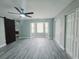 Main bedroom with a sliding barn door entry to the bathroom and large closet space at 726 Marion Oaks Ln, Ocala, FL 34473