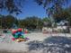 Community playground with swings, climbing structures, and play equipment offers recreation for families and children at 726 Marion Oaks Ln, Ocala, FL 34473