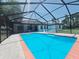 Gorgeous screened-in pool area, perfect for relaxation and entertaining in this beautifully built home at 726 Marion Oaks Ln, Ocala, FL 34473