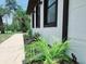 Side angle shot of a house that features updated landscaping and black trim at 726 Marion Oaks Ln, Ocala, FL 34473