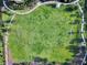 Aerial view of a large green field area with soccer goals and walking paths at 7527 Marker Ave, Kissimmee, FL 34747